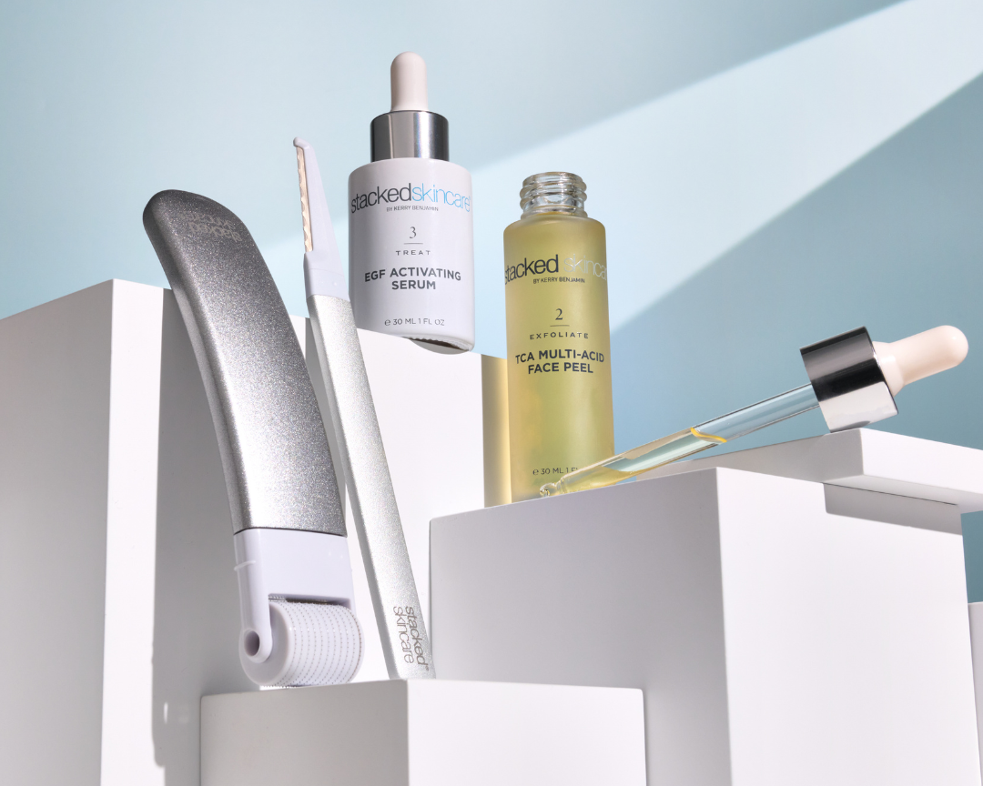 stackedskincare tools and skincare product displayed on boxes with natural light